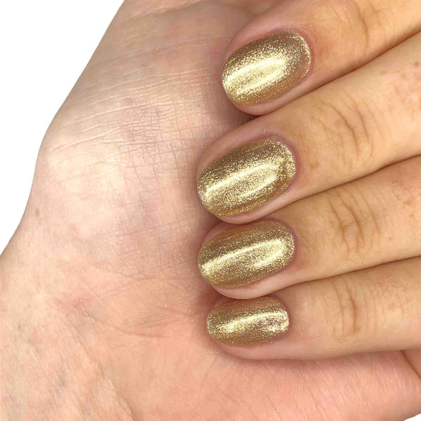 Soft gold glitter manicure
