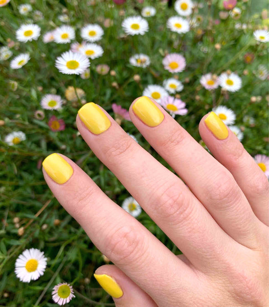 Bright yellow gel manicure