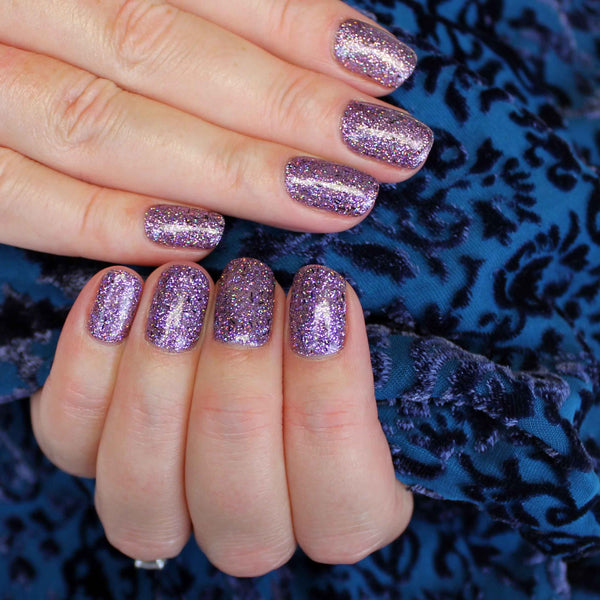 Violet glitter gel manicure