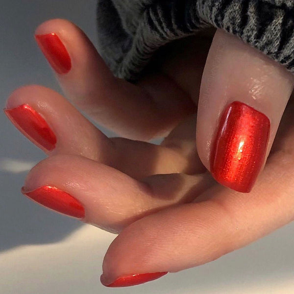 Shiny orange red nail
